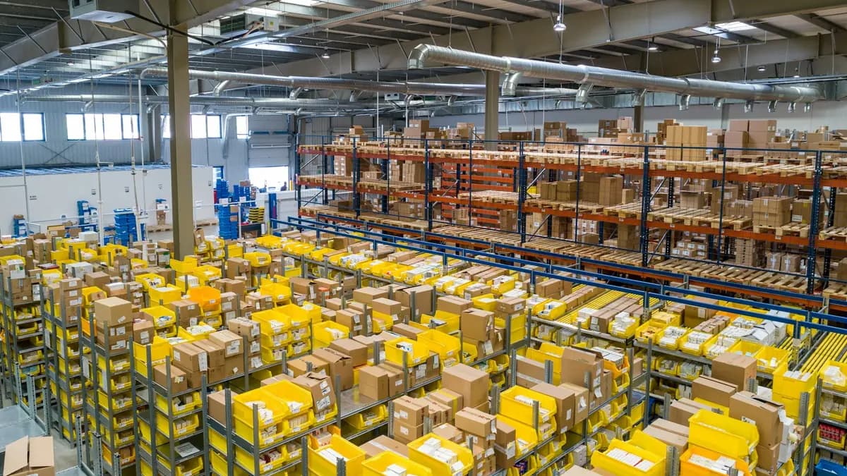 Interior of large modern warehouse in India with storage racks, forklifts, clean industrial lighting